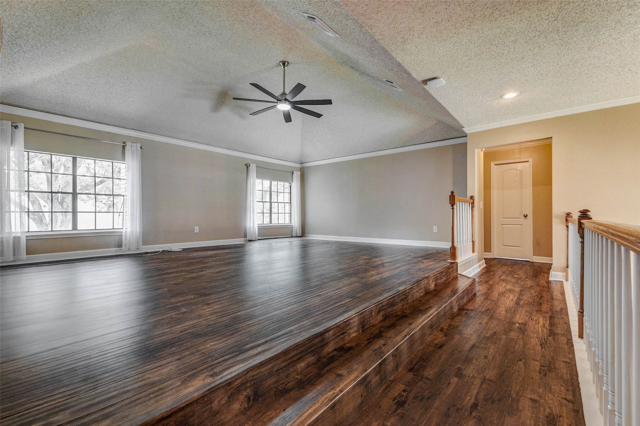 3107 Dulaney Road Houston, TX 77084 - Photo 27 of 50 a view of an empty room with window and wooden floor
