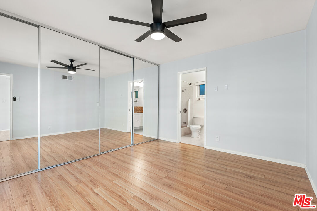 8255 Tuscany Avenue Playa del Rey, CA 90293 - Photo 13 of 24 a view of an empty room with a ceiling fan