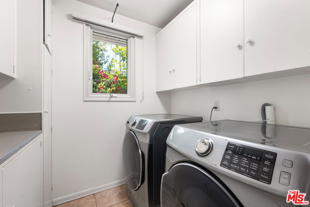 8255 Tuscany Avenue Playa del Rey, CA 90293 - Photo 14 of 24 a utility room with dryer and washer