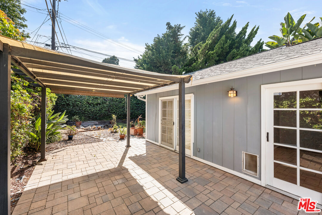 8255 Tuscany Avenue Playa del Rey, CA 90293 - Photo 23 of 24 a view of a patio with a table and chairs and potted plants