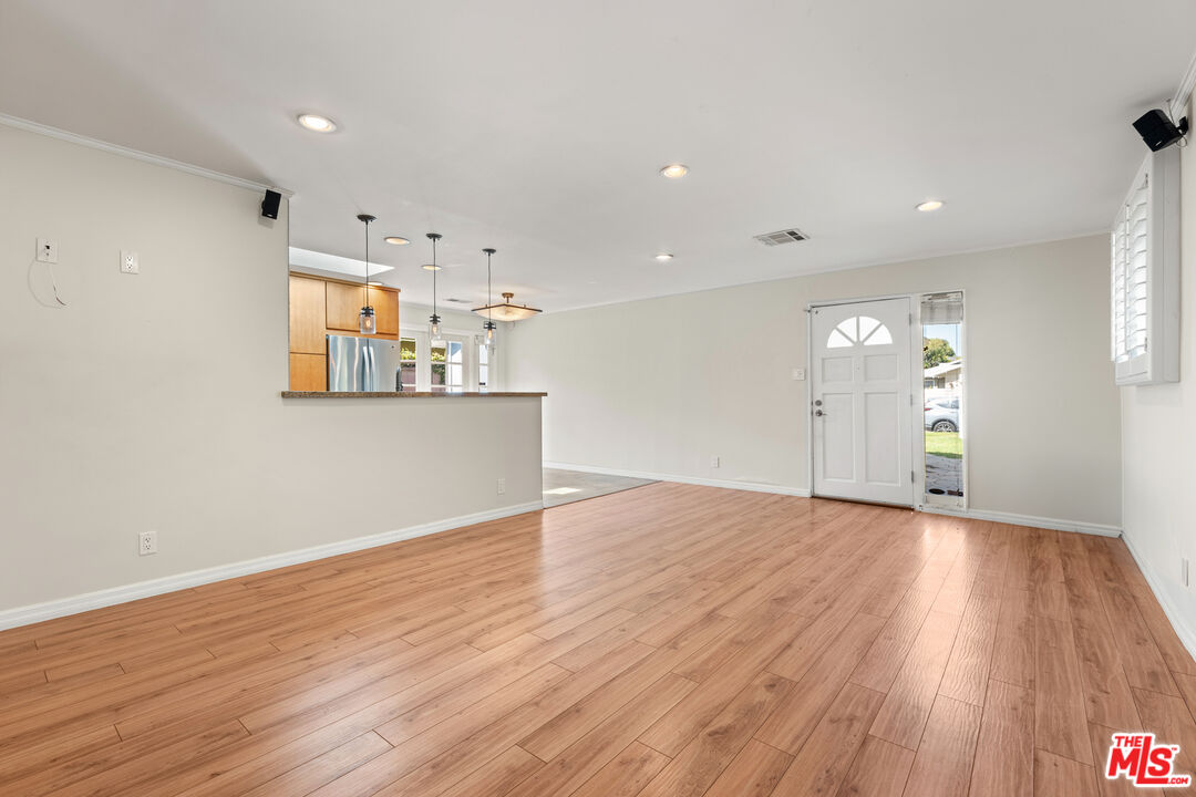 8255 Tuscany Avenue Playa del Rey, CA 90293 - Photo 9 of 24 an empty room with wooden floor and windows