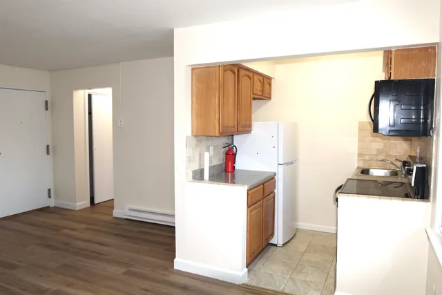 a kitchen with a sink and a refrigerator