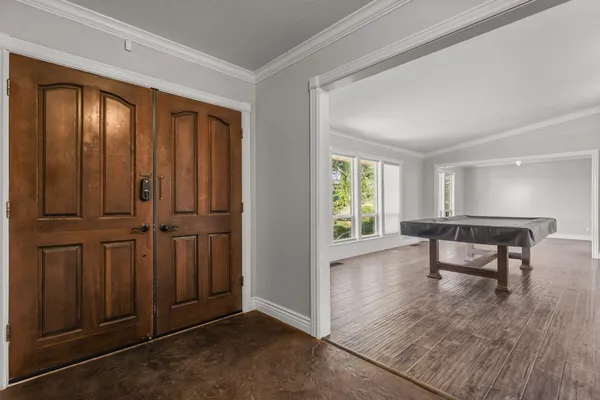 a view of a livingroom with furniture and wooden floor