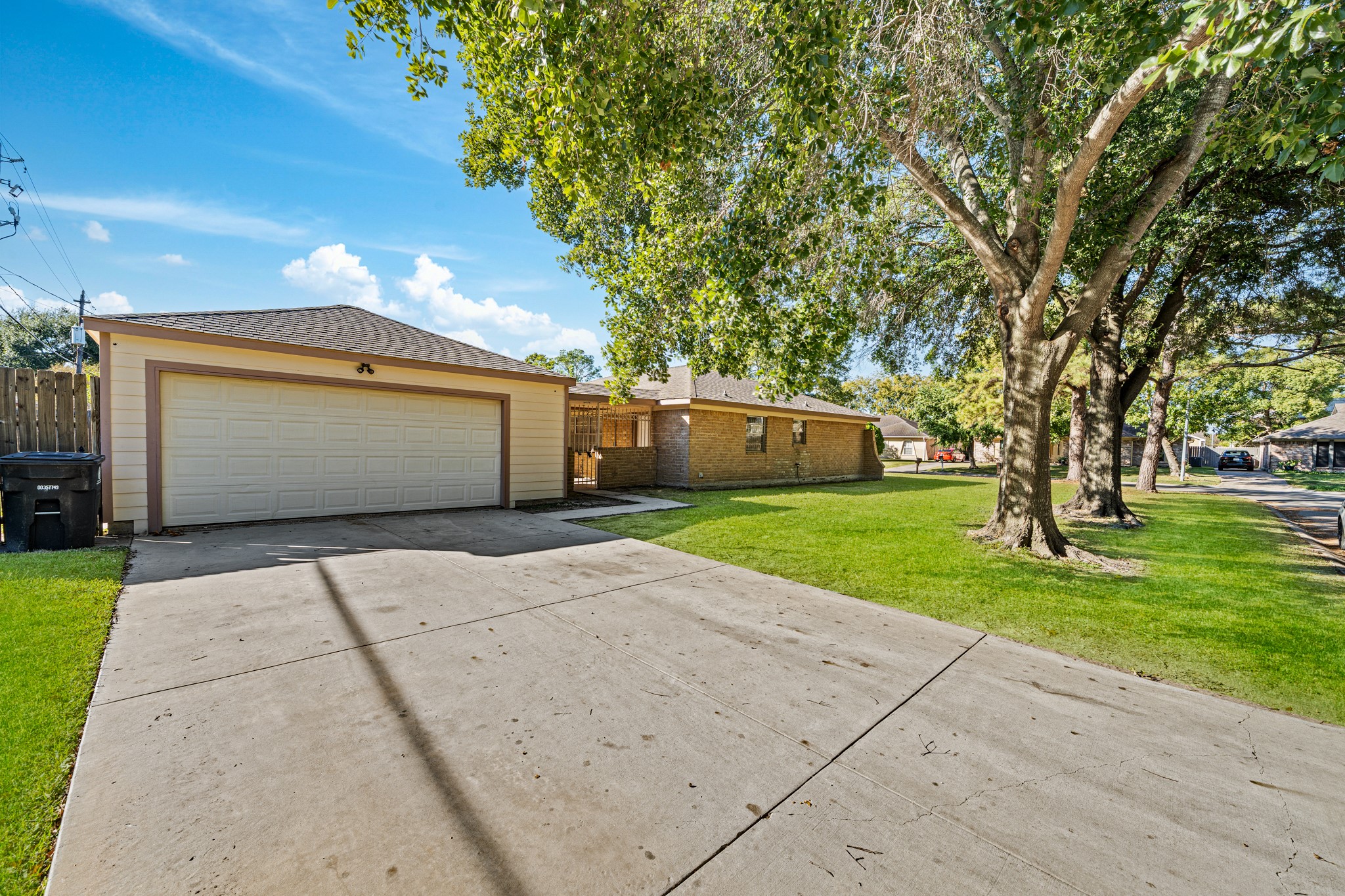 11503 High Star Drive Houston, TX 77072 - Photo 1 of 38 a front view of a house with a yard and a garage