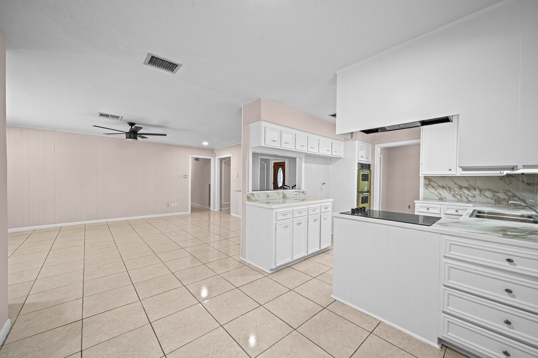 11503 High Star Drive Houston, TX 77072 - Photo 18 of 38 a view of kitchen with refrigerator cabinets and window