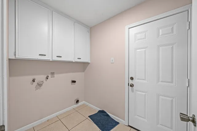 a view of room with white cabinets