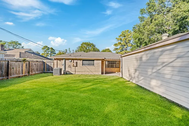 a view of a yard with a patio