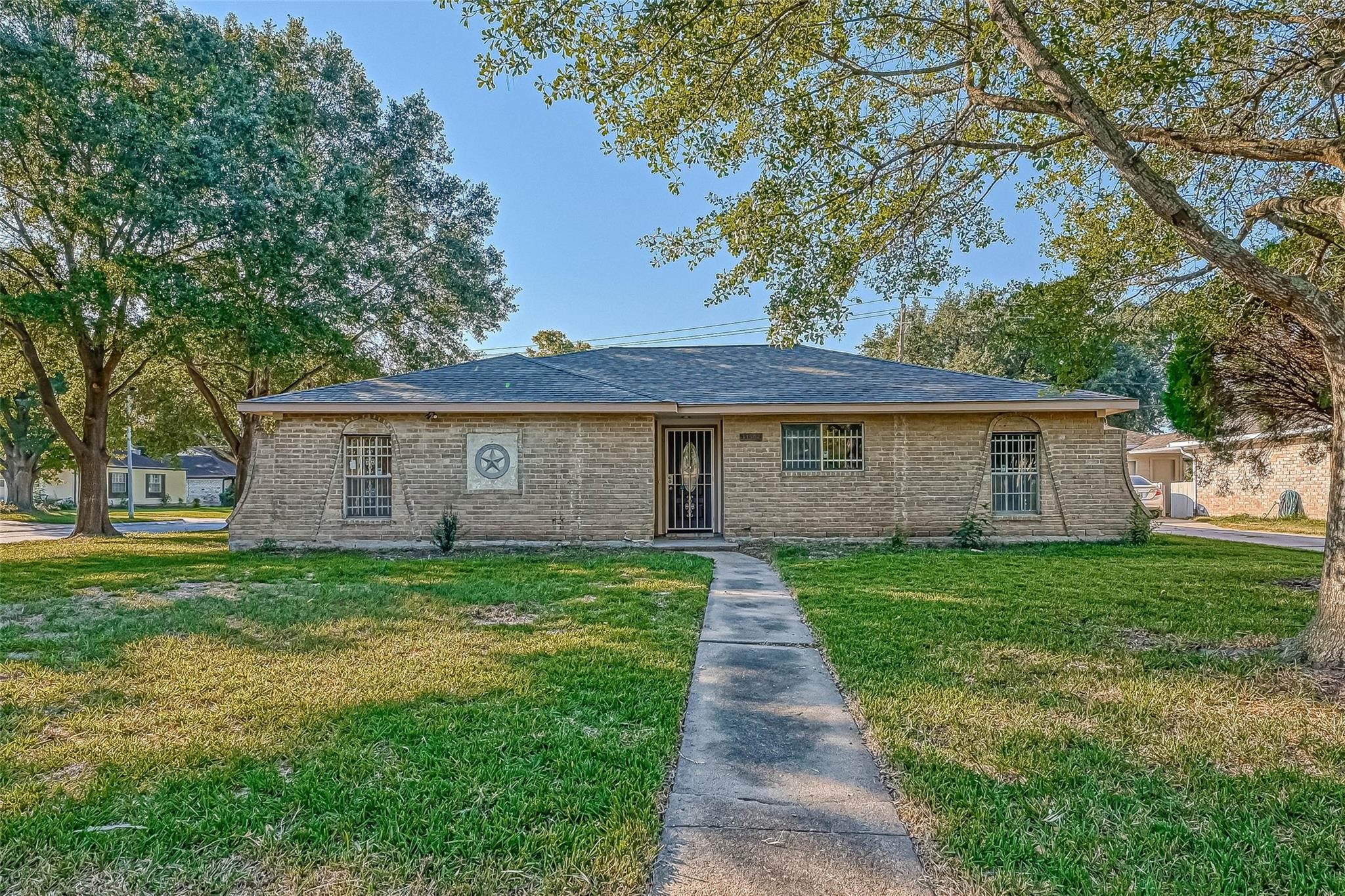 11503 High Star Drive Houston, TX 77072 - Photo 6 of 38 a front view of a house with yard