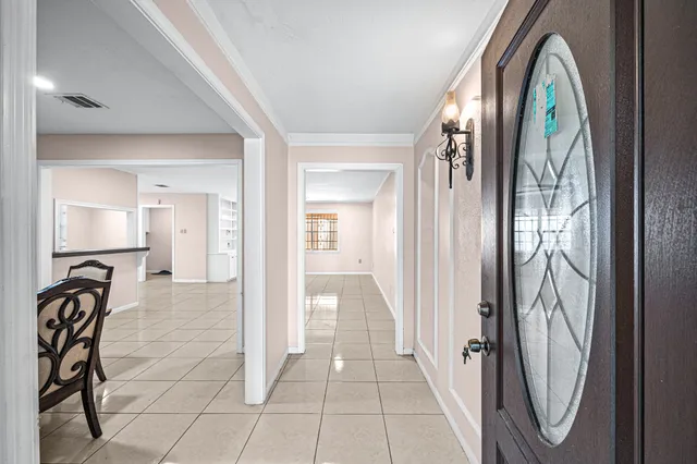 a view of a entryway door with a couch