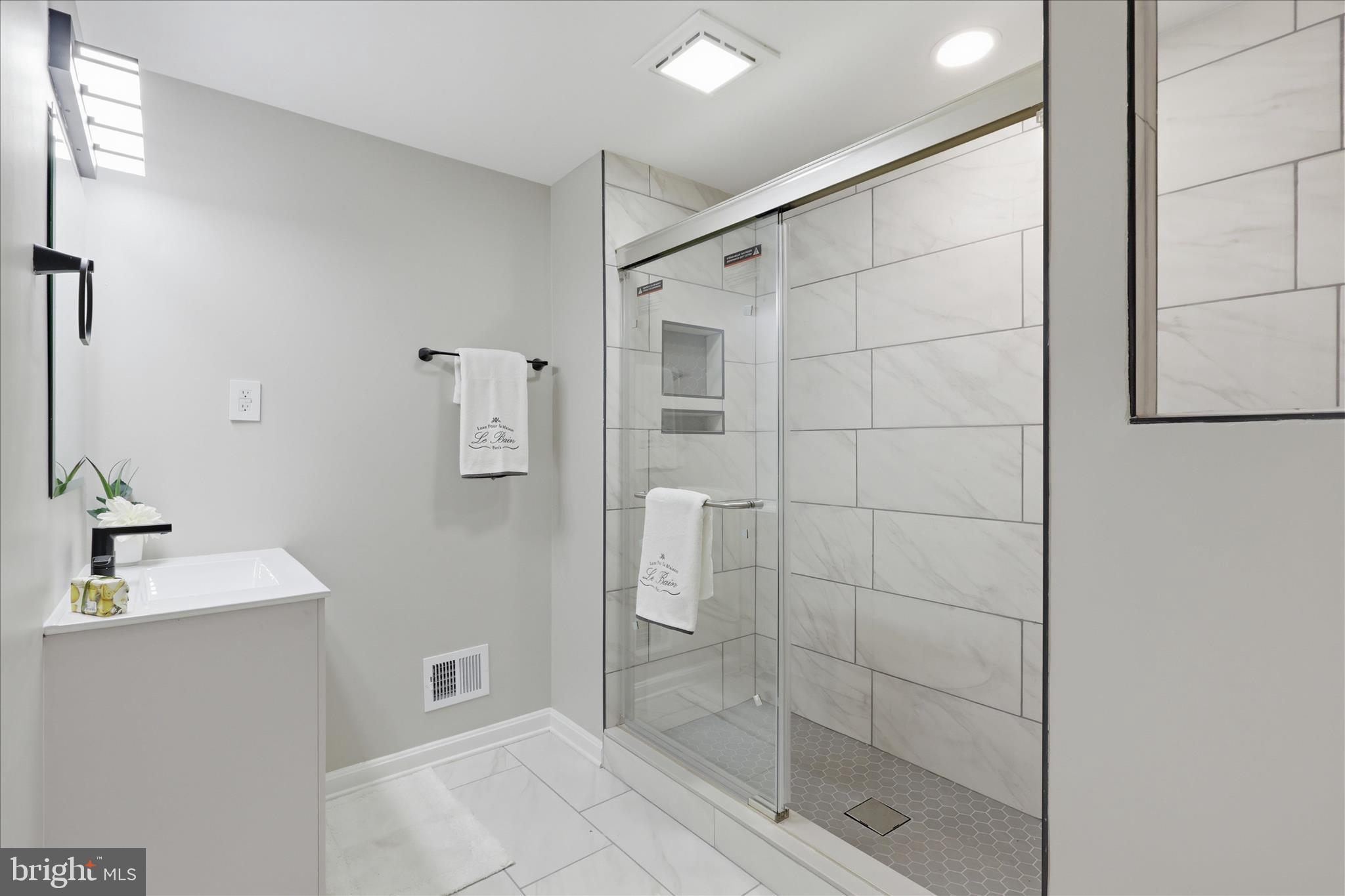 8855 Lowell Road Pomfret, MD 20675 - Photo 34 of 48 Lower level bathroom with walk-in shower