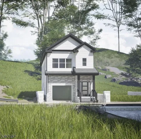 a front view of a house with a garden and yard
