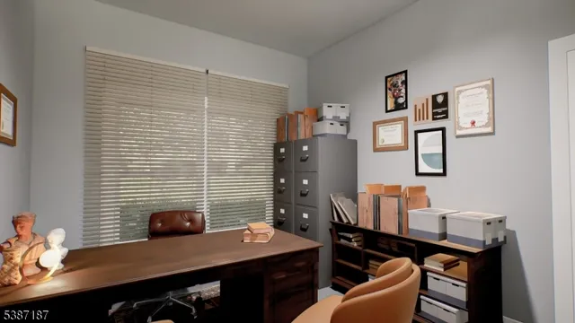 a view of a workspace with furniture