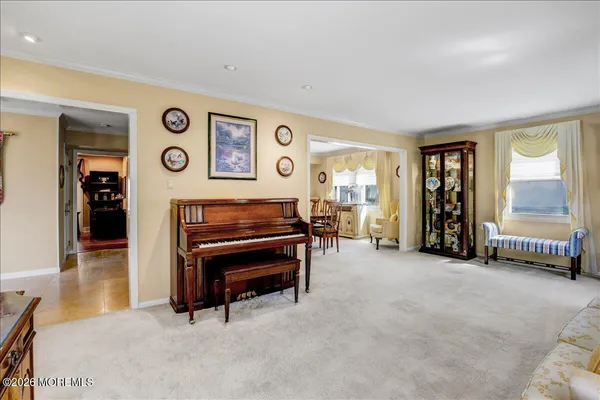 a kitchen with stainless steel appliances granite countertop a sink and a refrigerator