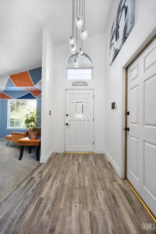 a living room with furniture a rug and a window