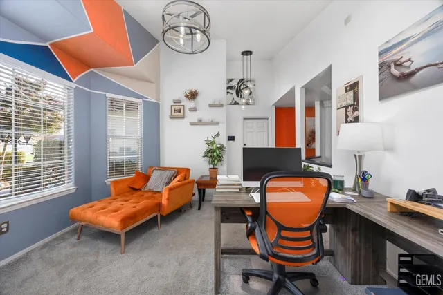 a dining room with furniture a chandelier and wooden floor