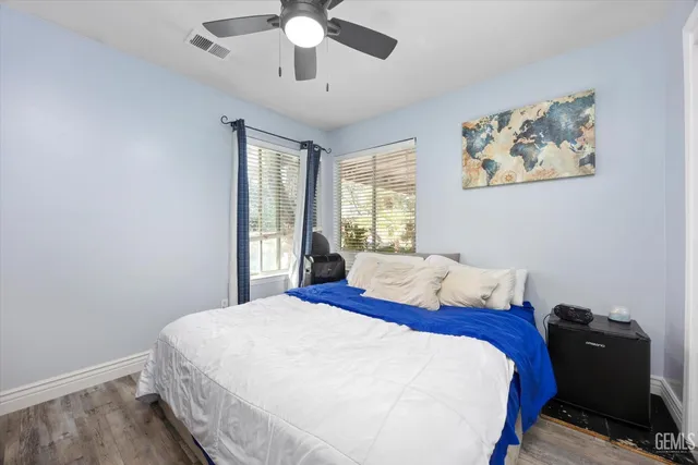 a room with gym equipment and windows