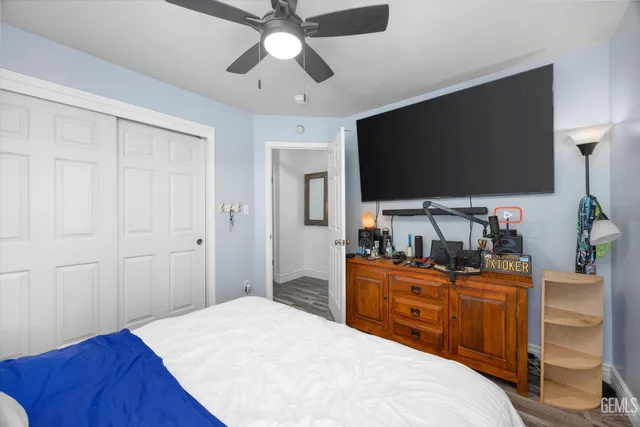 a view of a patio with a table chairs and a backyard