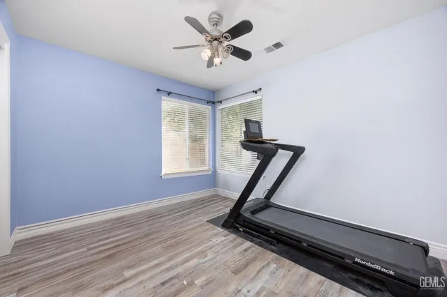 a view of a backyard with swimming pool