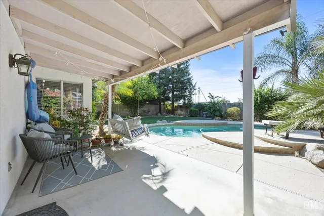 a view of a yard with palm trees