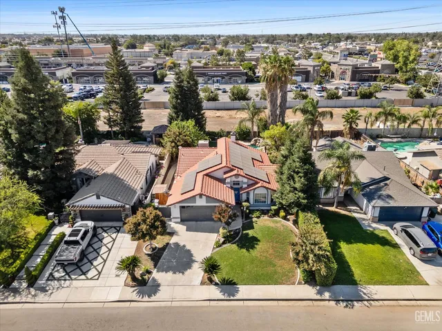 an aerial view of a house with a garden