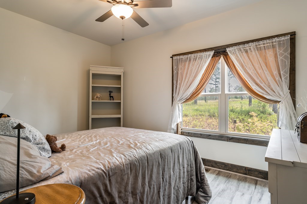 230 High River Road Ellijay, GA 30540 - Photo 12 of 27 a bedroom with a bed and a large window
