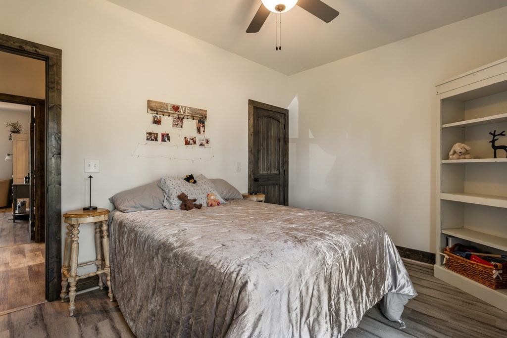 230 High River Road Ellijay, GA 30540 - Photo 13 of 27 a bedroom with a bed and a book shelf
