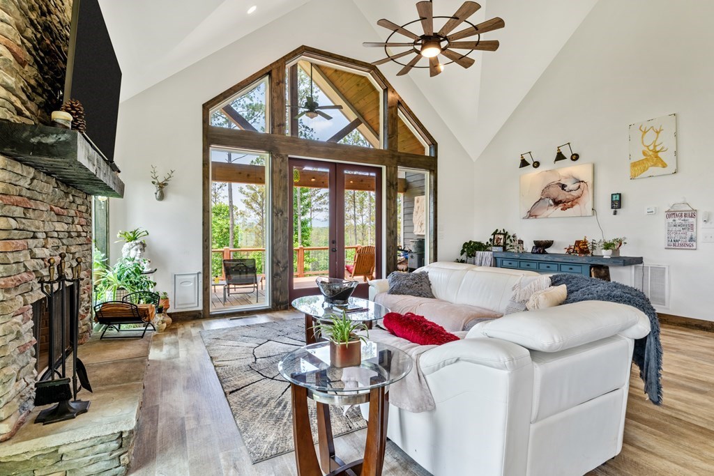 230 High River Road Ellijay, GA 30540 - Photo 3 of 27 a living room with fireplace furniture and a large window