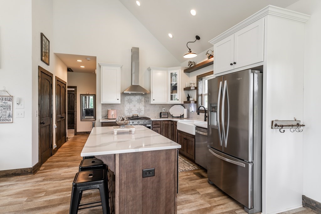 230 High River Road Ellijay, GA 30540 - Photo 5 of 27 a kitchen with stainless steel appliances a refrigerator sink and stove