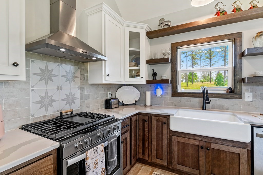 230 High River Road Ellijay, GA 30540 - Photo 6 of 27 a kitchen with stainless steel appliances granite countertop a sink stove and cabinets