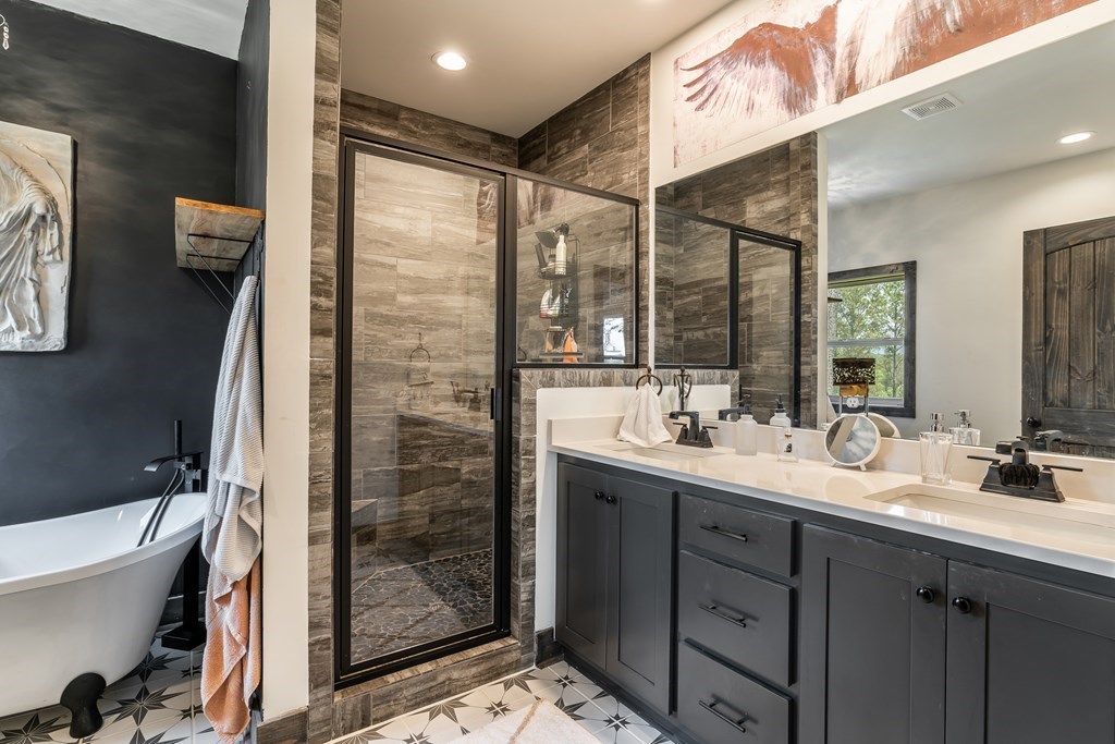 230 High River Road Ellijay, GA 30540 - Photo 9 of 27 a bathroom with a double vanity sink mirror and shower