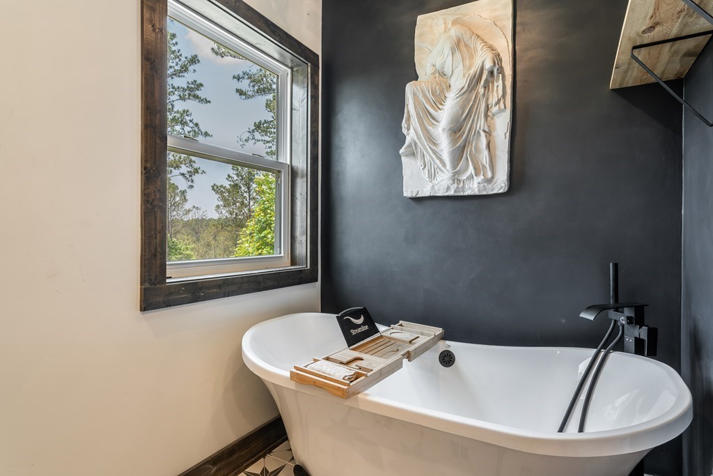 230 High River Road Ellijay, GA 30540 - Photo 10 of 27 a bathroom with a sink and bathtub