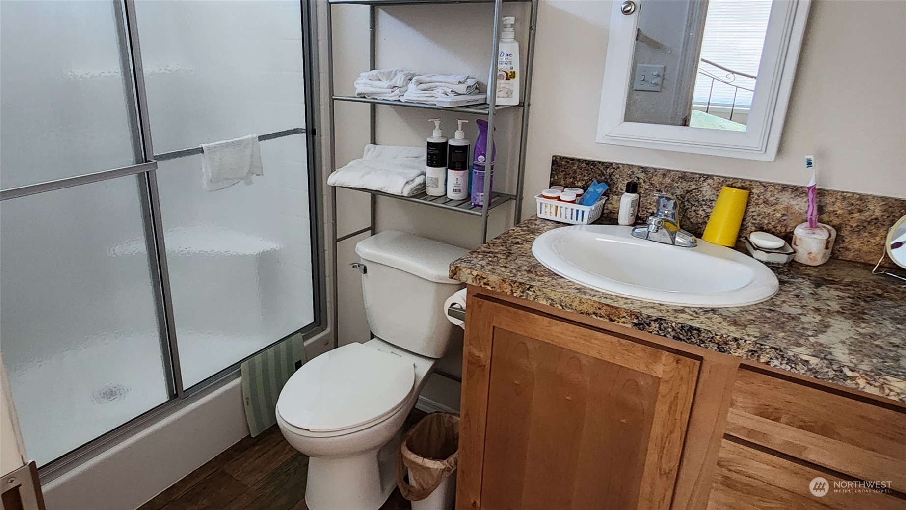 807 Mountain Villa Drive Enumclaw, WA 98022 - Photo 4 of 15 a bathroom with a granite countertop toilet sink and mirror