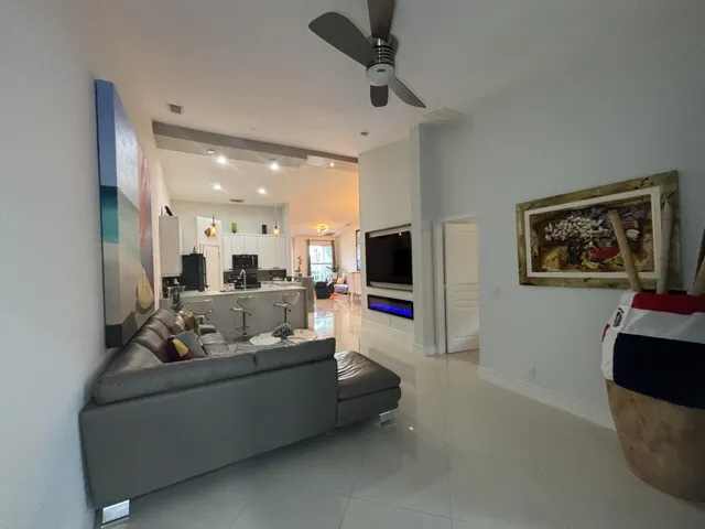 a living room with patio furniture and a couch