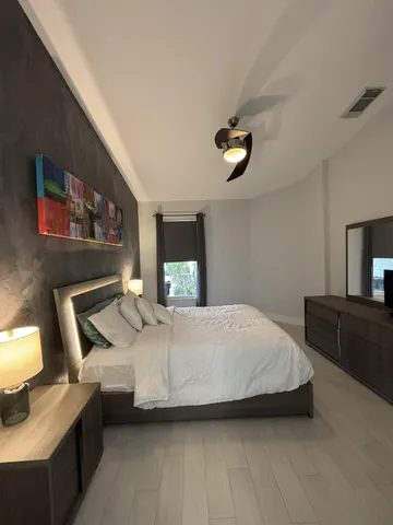 a bathroom with a sink a mirror and shower