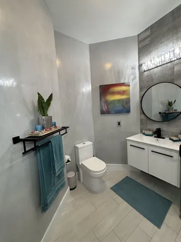 a bathroom with a sink and mirror