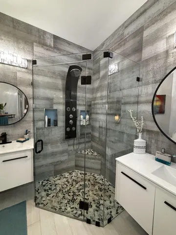 a living room with furniture and a mirror