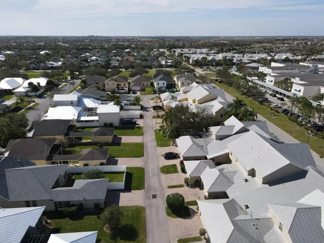 a swimming pool with outdoor seating and yard