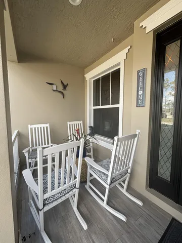 a bedroom with furniture and windows