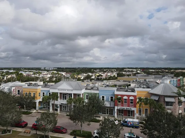 an aerial view of city and lake
