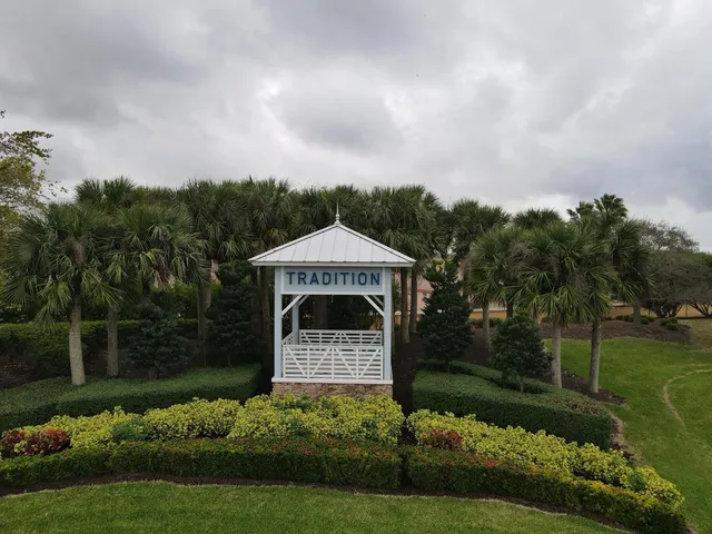 a view of a lake with a yard and outdoor seating