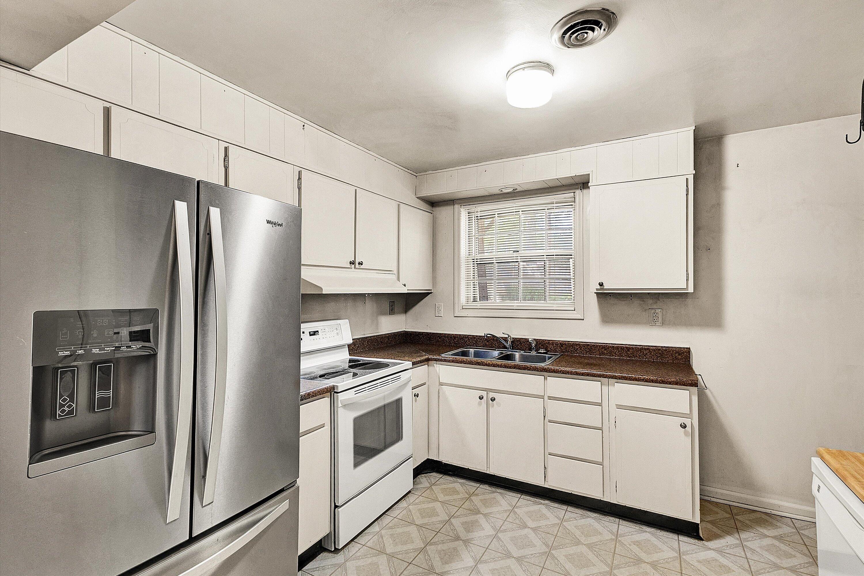 912 Cherokee Trail Covington, VA 24426 - Photo 7 of 31 a kitchen with white cabinets and white appliances