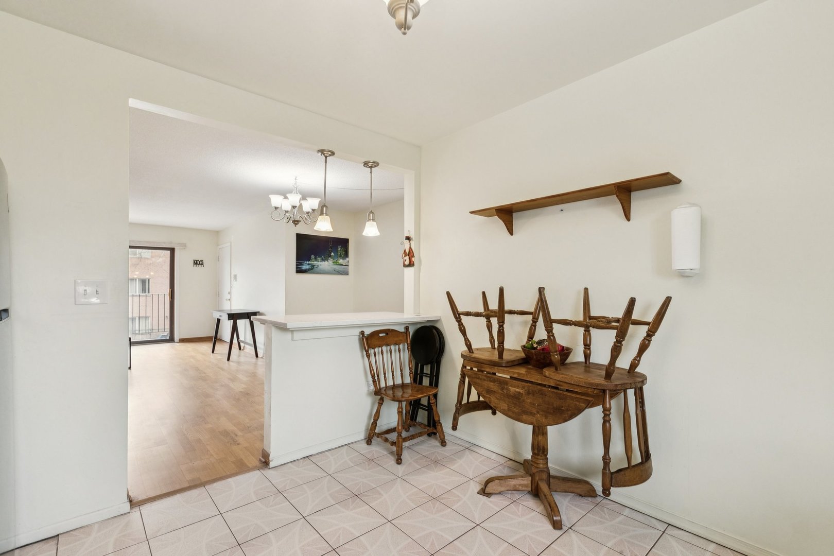 702 Cobblestone Circle, Unit D Glenview, IL 60025 - Photo 12 of 25 a view of a dining room with furniture and a chandelier