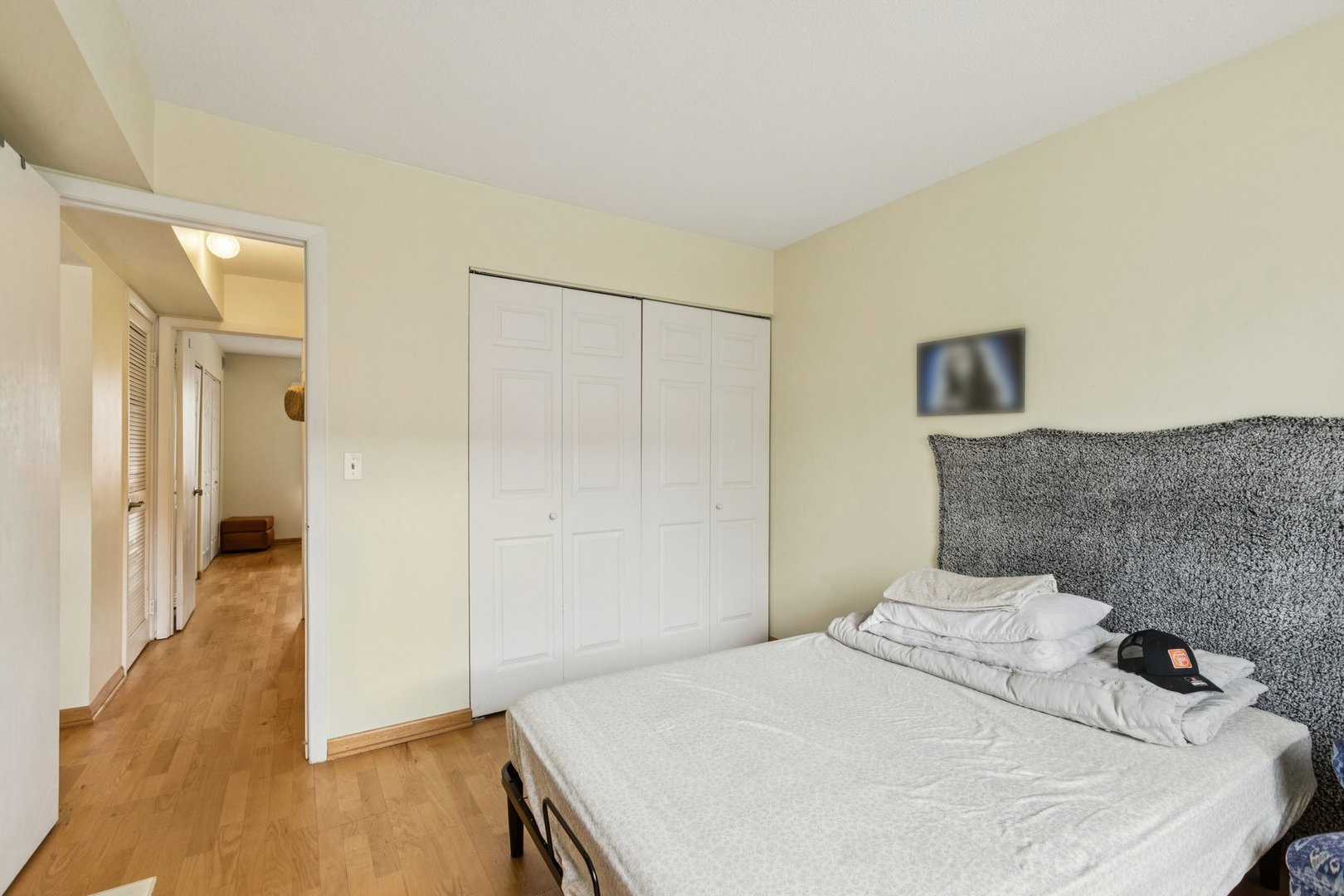 702 Cobblestone Circle, Unit D Glenview, IL 60025 - Photo 14 of 25 a bedroom with a bed and a wooden floor
