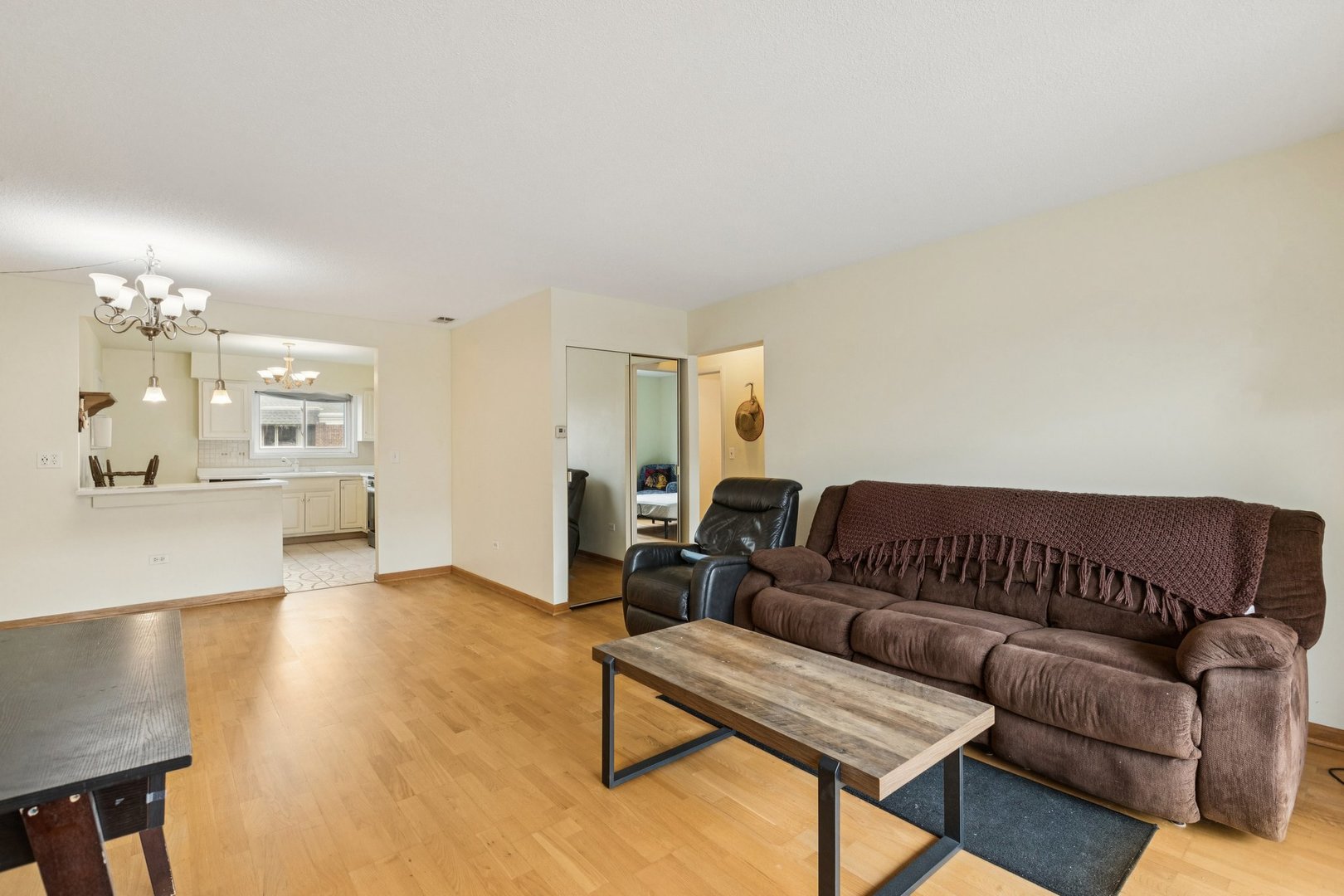 702 Cobblestone Circle, Unit D Glenview, IL 60025 - Photo 5 of 25 a living room with furniture and wooden floor