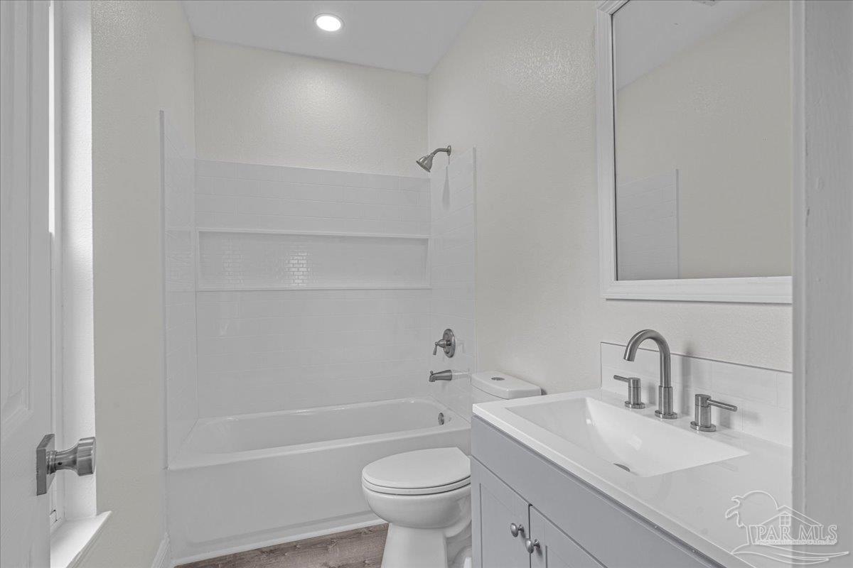 601 East Burgess Road, Unit C3 Pensacola, FL 32504 - Photo 25 of 35 a bathroom with a sink toilet vanity and tub