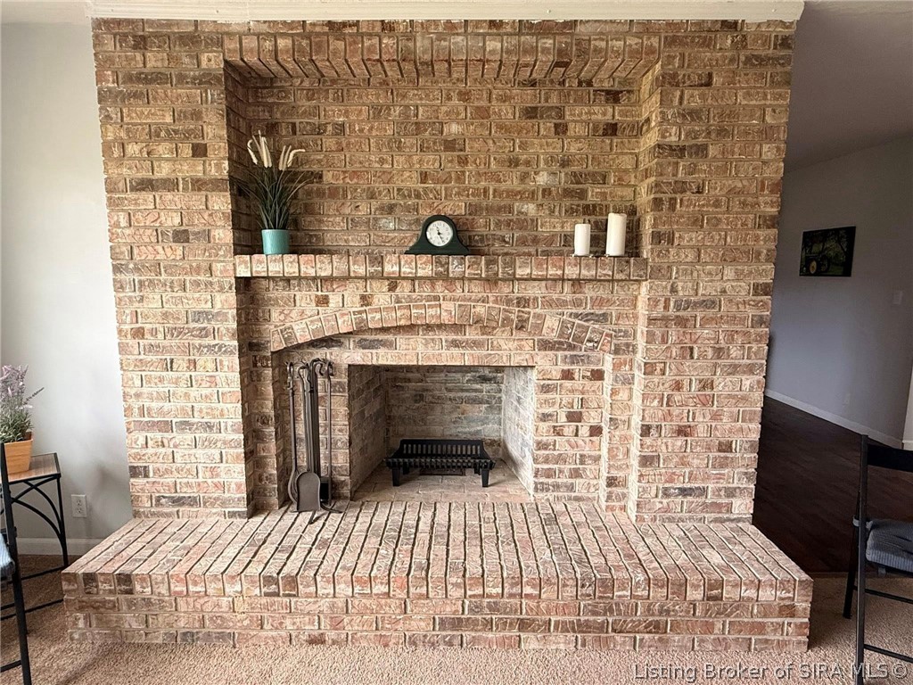 1110 West Helton Road Scottsburg, IN 47170 - Photo 9 of 22 wood burning fireplace in living room