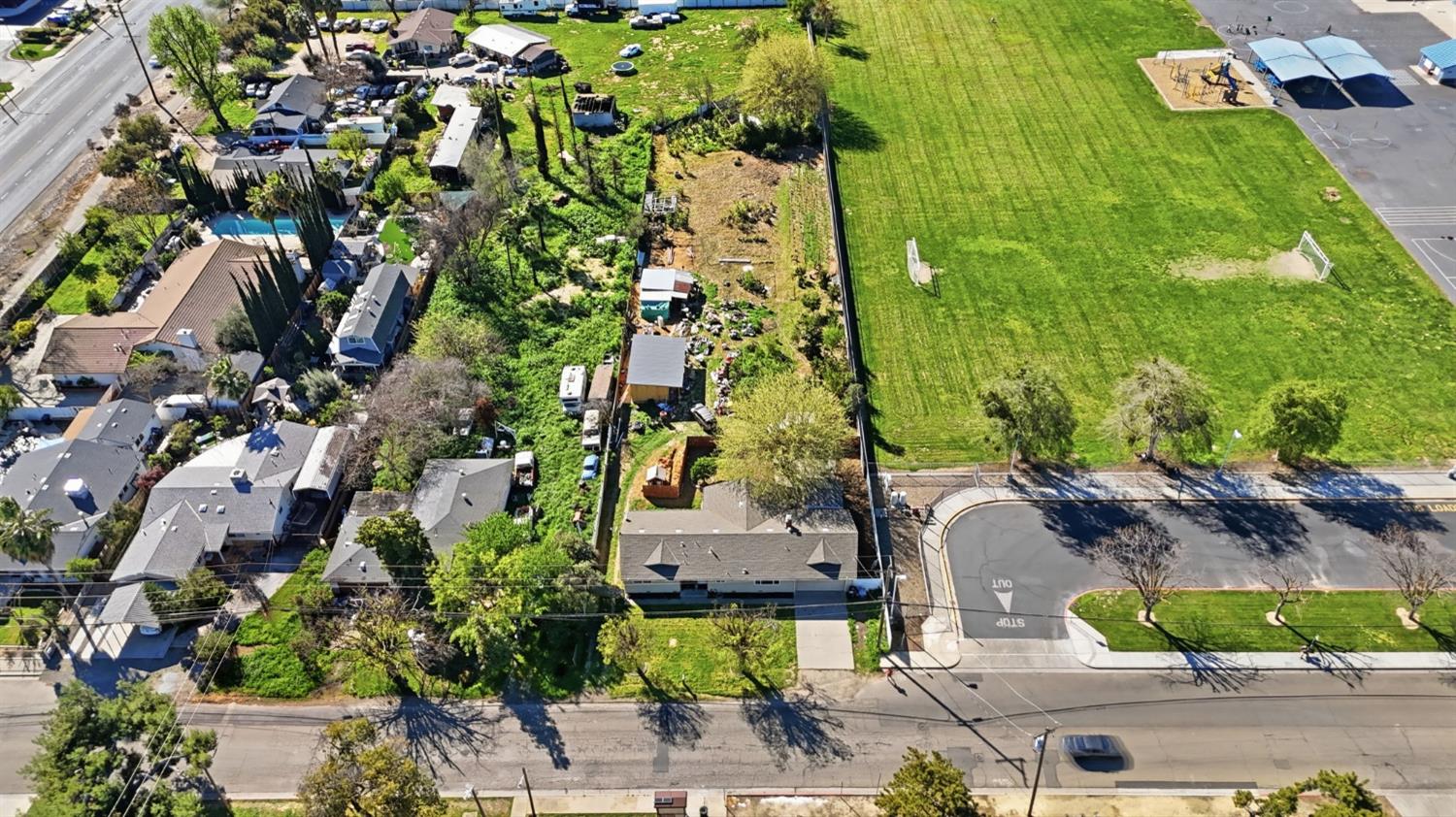 1409 Stonum Road Modesto, CA 95351 - Photo 34 of 40 an aerial view of residential houses with outdoor space