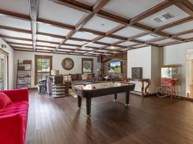 a living room with furniture and a clock