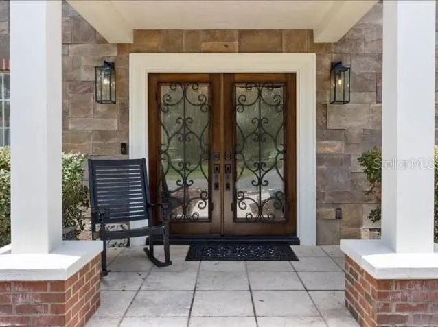 a view of entrance with stairs and wooden floor