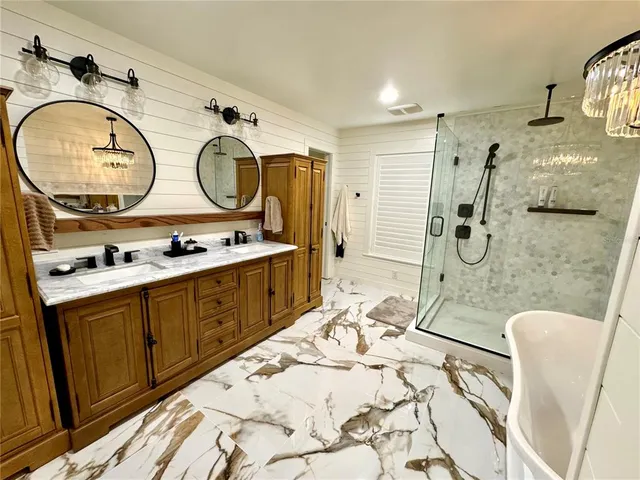 a view of bathroom with dual sinks